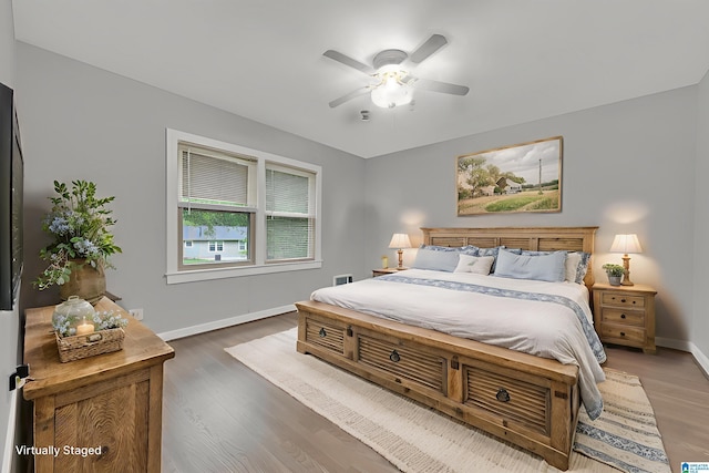 2028 Moncrief Rd, Gardendale, AL 35071 - bedroom with wood finished floors, baseboards, and a ceiling fan