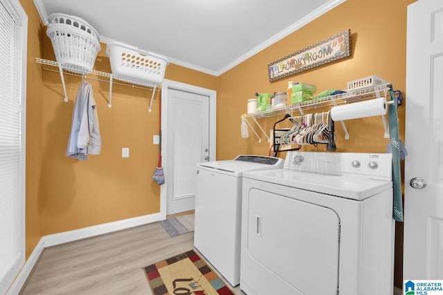 2028 Moncrief Rd, Gardendale, AL 35071 - washroom with washer and dryer, crown molding, light wood finished floors, and baseboards