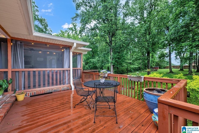 2028 Moncrief Rd, Gardendale, AL 35071 - deck with outdoor dining space and a sunroom