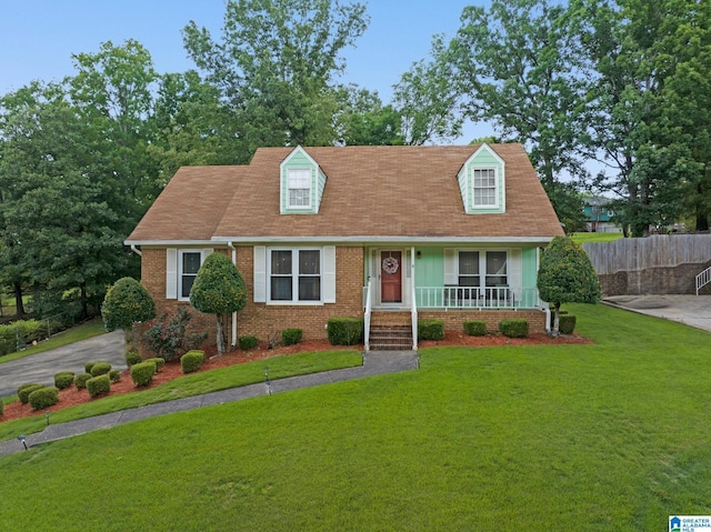 916 Woodbrook Rd, Center Point, AL 35215 - cape cod house featuring covered porch and brick siding