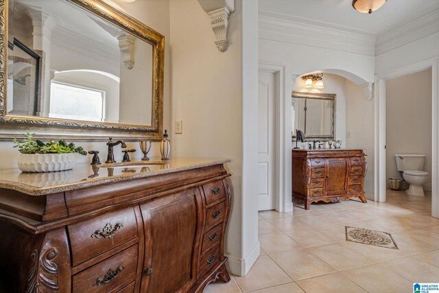 386 N Lake Rd, Birmingham, AL 35242 - bathroom featuring vanity, tile patterned floors, toilet, ornamental molding, and a shower with shower door