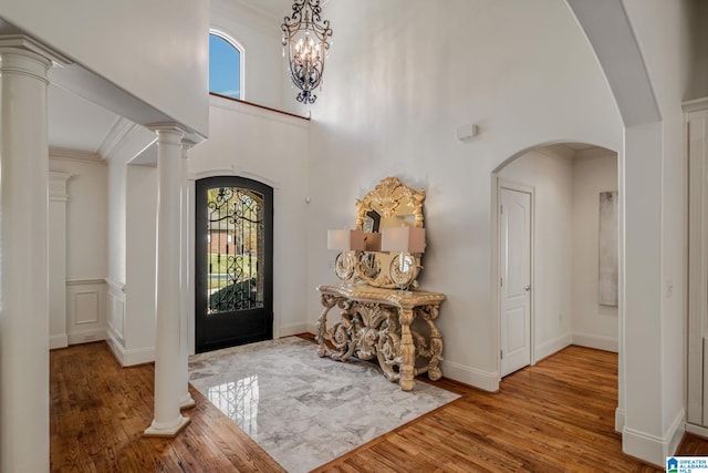 386 N Lake Rd, Birmingham, AL 35242 - entryway with wood finished floors, plenty of natural light, crown molding, arched walkways, and a towering ceiling
