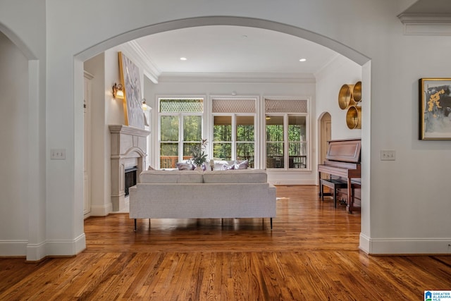 386 N Lake Rd, Birmingham, AL 35242 - living area featuring ornamental molding, wood finished floors, baseboards, a fireplace, and arched walkways