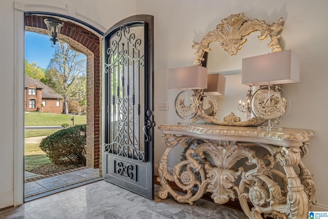 386 N Lake Rd, Birmingham, AL 35242 - foyer entrance with a chandelier and marble look tile flooring