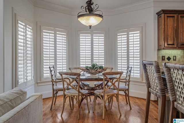 386 N Lake Rd, Birmingham, AL 35242 - dining space featuring crown molding, light wood-type flooring, and baseboards