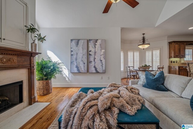 386 N Lake Rd, Birmingham, AL 35242 - living area with vaulted ceiling, ceiling fan, light wood-style floors, a premium fireplace, and baseboards