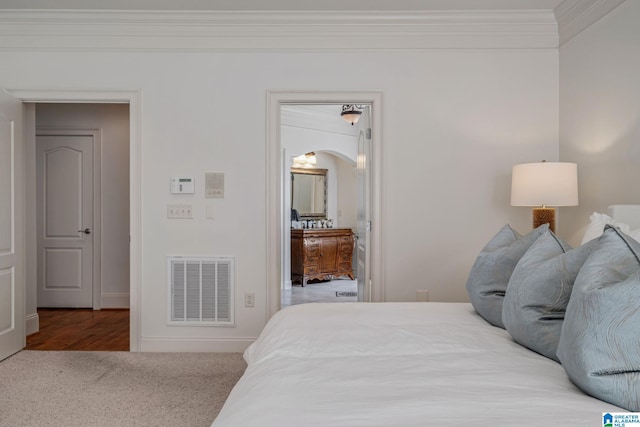 386 N Lake Rd, Birmingham, AL 35242 - carpeted bedroom featuring crown molding, arched walkways, and baseboards