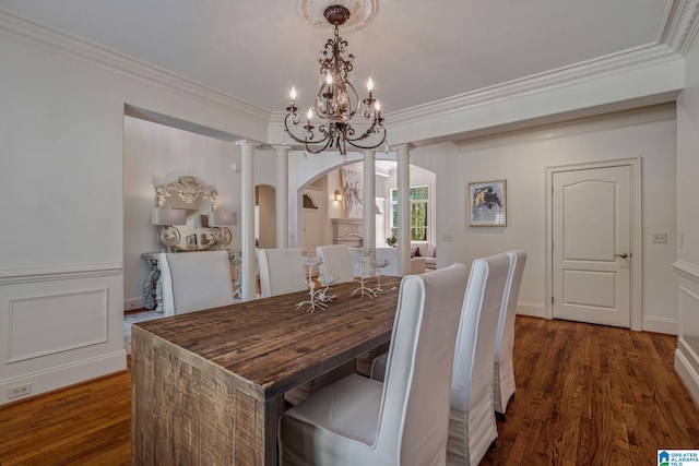 386 N Lake Rd, Birmingham, AL 35242 - dining room featuring arched walkways, decorative columns, dark wood-style flooring, crown molding, and a chandelier