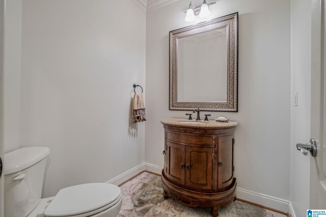 386 N Lake Rd, Birmingham, AL 35242 - half bathroom featuring toilet, baseboards, crown molding, and vanity