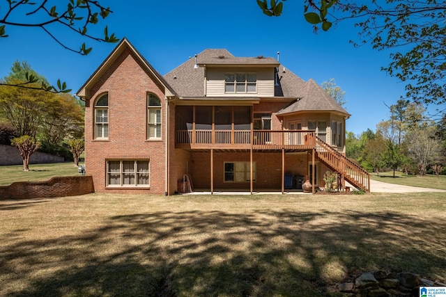 386 N Lake Rd, Birmingham, AL 35242 - back of property featuring a sunroom, brick siding, stairway, a patio area, and a lawn