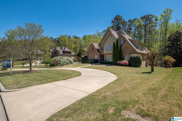 386 N Lake Rd, Birmingham, AL 35242 - view of front of house with a front yard and curved driveway