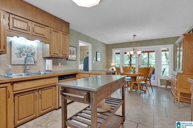 3258 Tyrol Ln, Vestavia Hills, AL 35216 - kitchen with dishwasher, a sink, a chandelier, tasteful backsplash, and light countertops