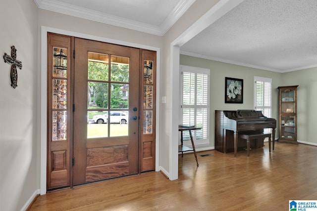 3258 Tyrol Ln, Vestavia Hills, AL 35216 - entrance foyer with wood finished floors, crown molding, baseboards, and a textured ceiling