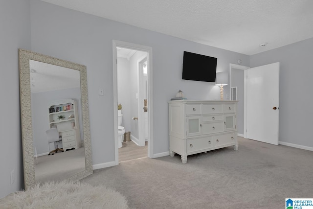 3258 Tyrol Ln, Vestavia Hills, AL 35216 - bedroom with carpet floors, baseboards, connected bathroom, and a textured ceiling