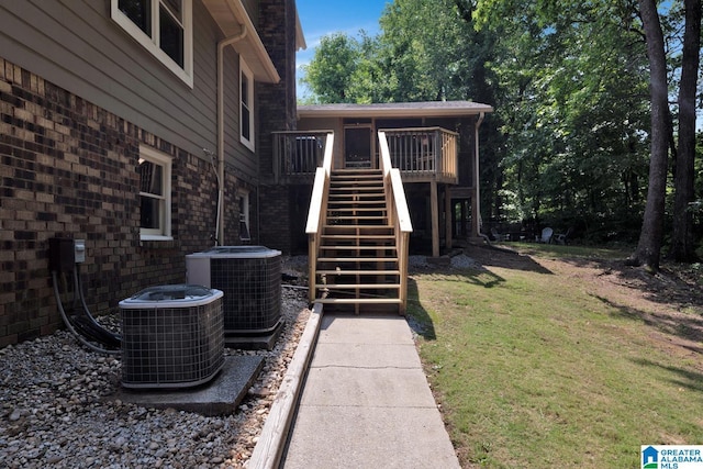 3258 Tyrol Ln, Vestavia Hills, AL 35216 - exterior space featuring central AC, stairway, a wooden deck, and a yard