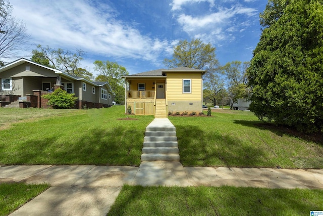 906 6th Ave W, Birmingham, AL 35204 - bungalow featuring covered porch, a front yard, stairway, and crawl space
