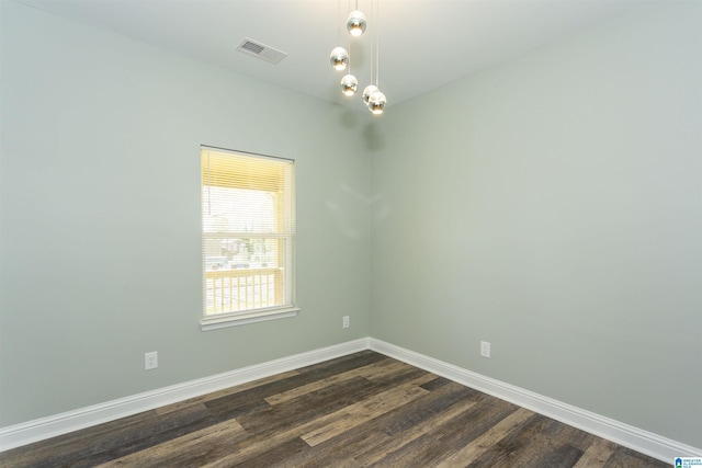 906 6th Ave W, Birmingham, AL 35204 - empty room with baseboards and dark wood-type flooring