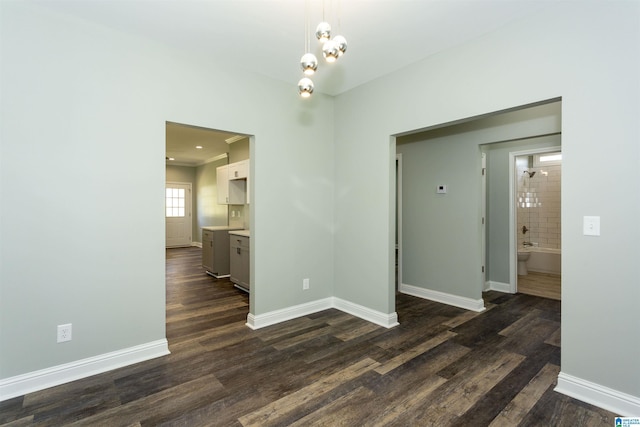 906 6th Ave W, Birmingham, AL 35204 - empty room with dark wood-type flooring and baseboards