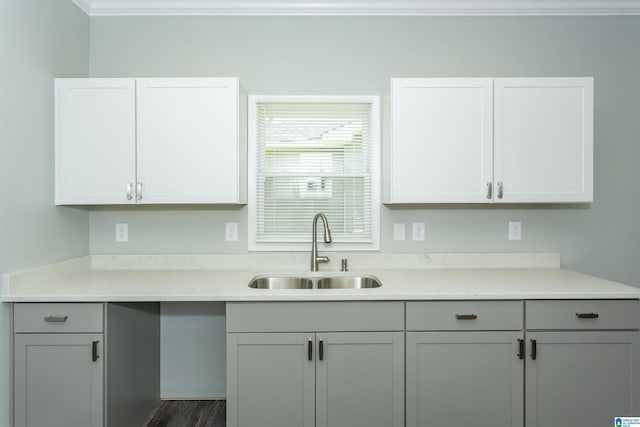 906 6th Ave W, Birmingham, AL 35204 - kitchen featuring a sink, light countertops, crown molding, gray cabinets, and dark wood-style flooring