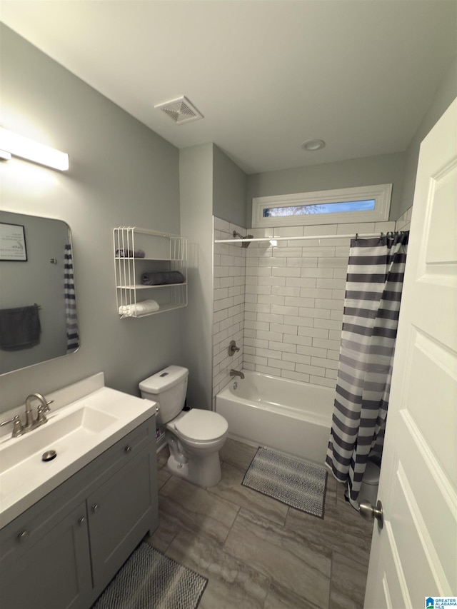 906 6th Ave W, Birmingham, AL 35204 - full bath with vanity, toilet, and shower / bath combo with shower curtain