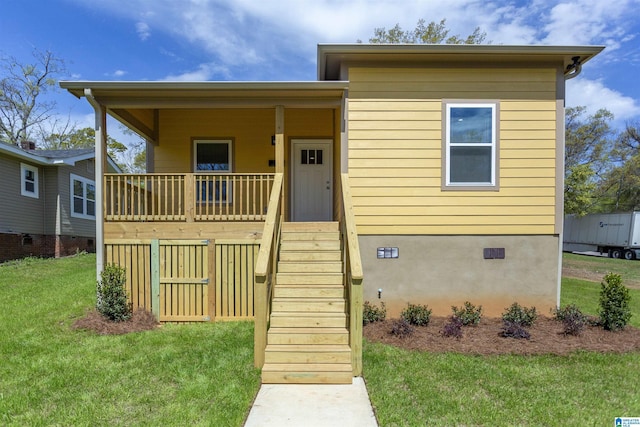 906 6th Ave W, Birmingham, AL 35204 - view of front of home featuring stairway, a front lawn, crawl space, and a porch