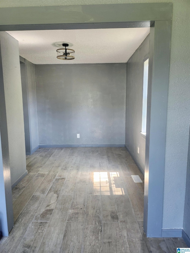 2125 Henry Crumpton Dr, Birmingham, AL 35211 - spare room with wood finished floors and baseboards