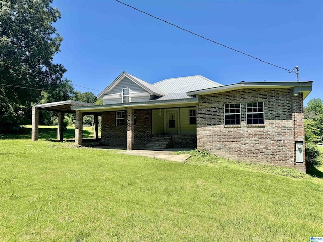 40 Sulfur Springs Rd, Springville, AL 35146 - view of front of property featuring brick siding, a front lawn, and covered porch