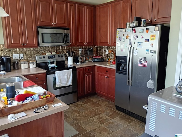 115 Clover St, Odenville, AL 35120 - kitchen featuring stainless steel appliances, decorative backsplash, and light countertops