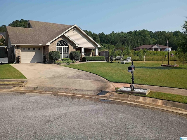 115 Clover St, Odenville, AL 35120 - view of front of home with a front lawn, concrete driveway, a garage, and brick siding
