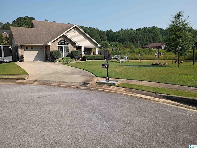 115 Clover St, Odenville, AL 35120 - view of front of property featuring driveway, a front lawn, and an attached garage