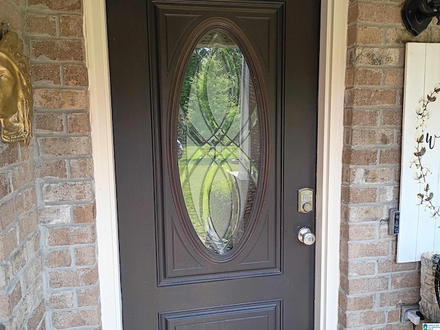 115 Clover St, Odenville, AL 35120 - doorway to property featuring brick siding