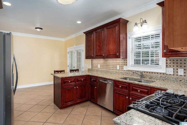 101 Mill Rd, Springville, AL 35146 - kitchen featuring stainless steel appliances, a peninsula, crown molding, light tile patterned floors, and tasteful backsplash