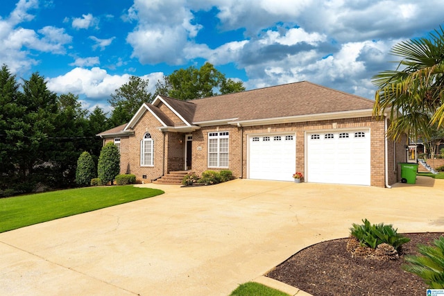 101 Mill Rd, Springville, AL 35146 - view of front of house with brick siding, driveway, an attached garage, and a front yard