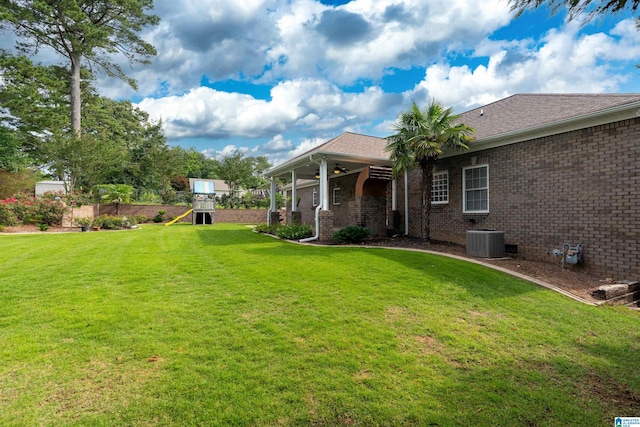 101 Mill Rd, Springville, AL 35146 - view of green lawn with ceiling fan and a playground