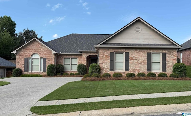 429 Eaton Rd, Hoover, AL 35242 - view of front of house with brick siding, roof with shingles, and a front lawn