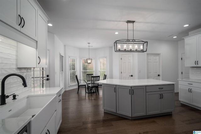 429 Eaton Rd, Hoover, AL 35242 - kitchen with a sink, recessed lighting, backsplash, a chandelier, and dark wood-style floors