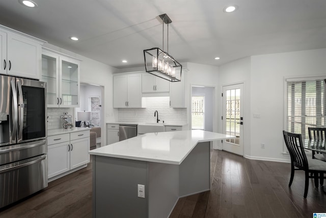 429 Eaton Rd, Hoover, AL 35242 - kitchen featuring stainless steel appliances, tasteful backsplash, glass insert cabinets, white cabinets, and recessed lighting
