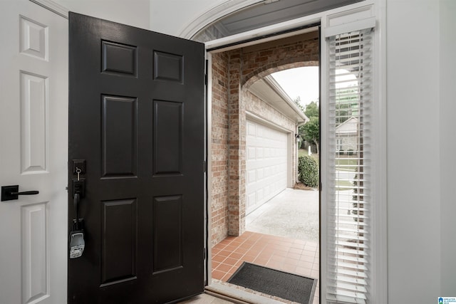 429 Eaton Rd, Hoover, AL 35242 - entryway featuring brick wall, tile patterned floors, and arched walkways