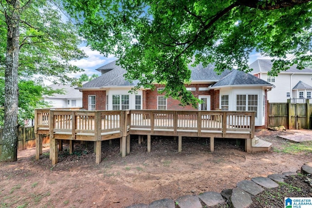 4728 Red Leaf Cir, Hoover, AL 35226 - back of house with a fenced backyard, brick siding, and a deck