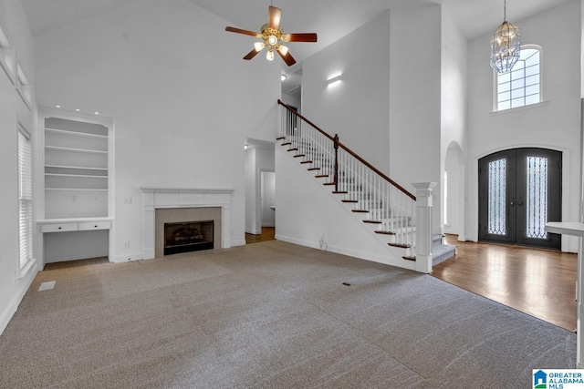4728 Red Leaf Cir, Hoover, AL 35226 - carpeted entrance foyer featuring a towering ceiling, arched walkways, baseboards, french doors, and stairs