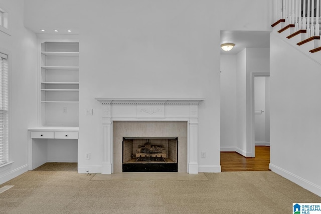 4728 Red Leaf Cir, Hoover, AL 35226 - unfurnished living room with carpet flooring, built in features, a fireplace with flush hearth, baseboards, and recessed lighting
