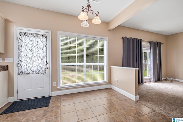 538 Forest Lakes Dr, Sterrett, AL 35147 - entrance foyer featuring beam ceiling, baseboards, tile patterned floors, and a chandelier
