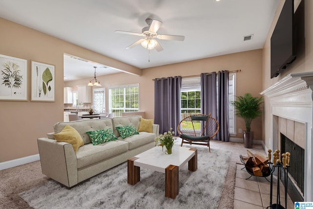 538 Forest Lakes Dr, Sterrett, AL 35147 - living room with healthy amount of natural light, ceiling fan, baseboards, and a fireplace with flush hearth
