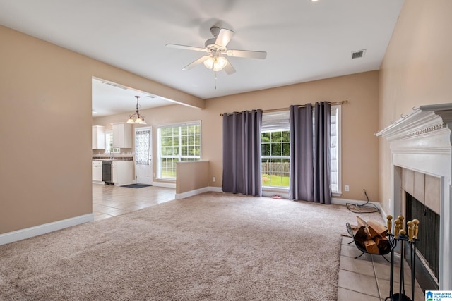 538 Forest Lakes Dr, Sterrett, AL 35147 - unfurnished living room featuring light carpet, ceiling fan, baseboards, and a fireplace with flush hearth
