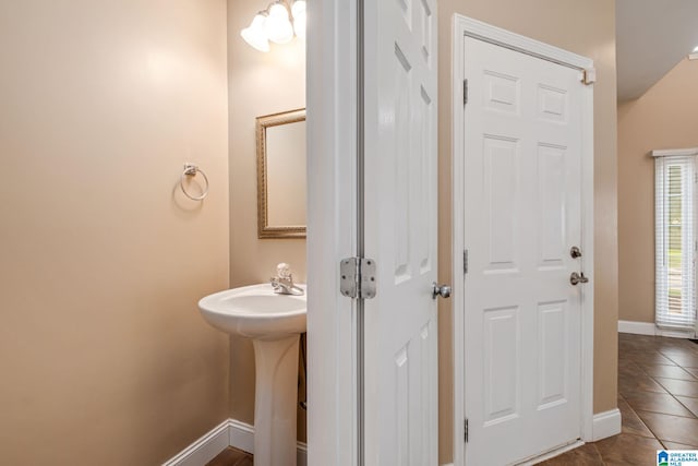 538 Forest Lakes Dr, Sterrett, AL 35147 - bathroom with tile patterned flooring, baseboards, and a sink