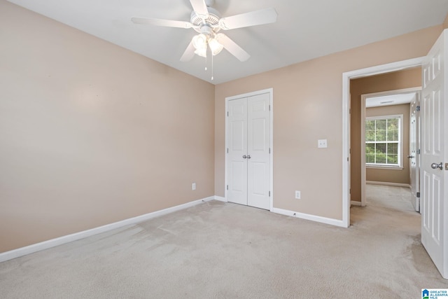538 Forest Lakes Dr, Sterrett, AL 35147 - unfurnished bedroom featuring baseboards, light carpet, a closet, and ceiling fan