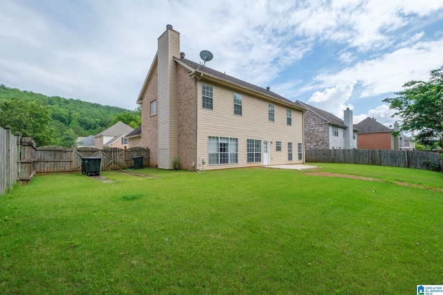 538 Forest Lakes Dr, Sterrett, AL 35147 - rear view of house with a chimney and a patio area