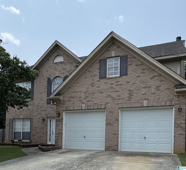 538 Forest Lakes Dr, Sterrett, AL 35147 - view of front of home with driveway, brick siding, and a garage
