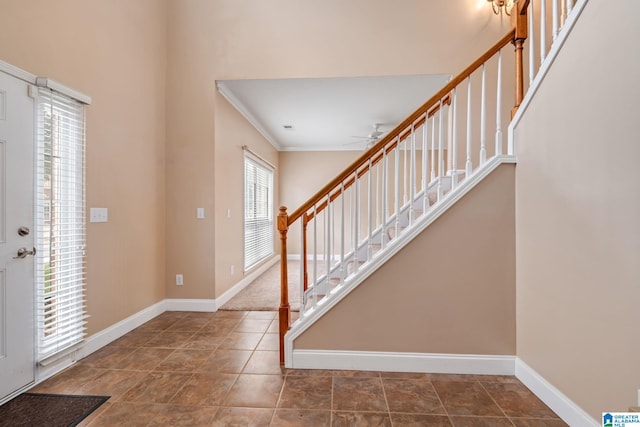 538 Forest Lakes Dr, Sterrett, AL 35147 - foyer entrance with stairway, baseboards, ornamental molding, and a ceiling fan