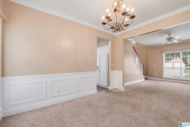 538 Forest Lakes Dr, Sterrett, AL 35147 - empty room with light carpet, a chandelier, stairway, a wainscoted wall, and crown molding